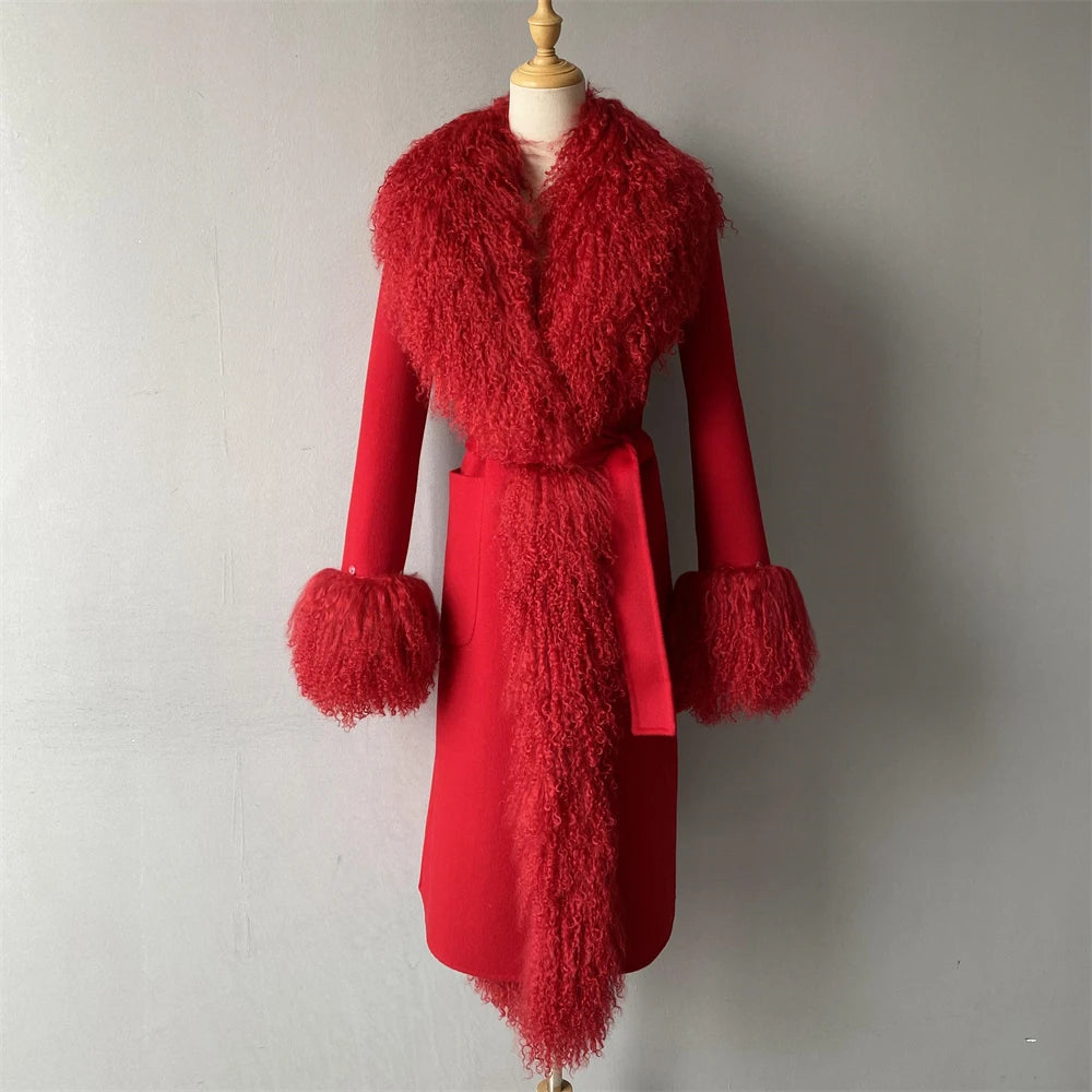 Red coat with fluffy collar and cuffs on a mannequin against a plain background
