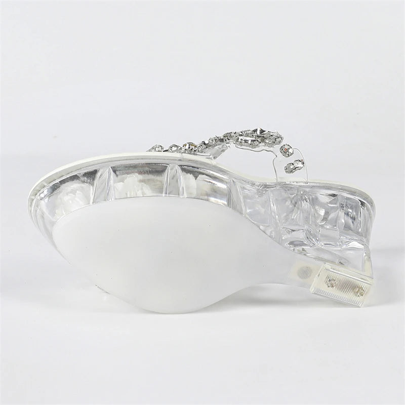 Silver ring with a clear gemstone on a white background
