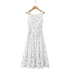 White dress with pink floral pattern on a wooden hanger against a white background