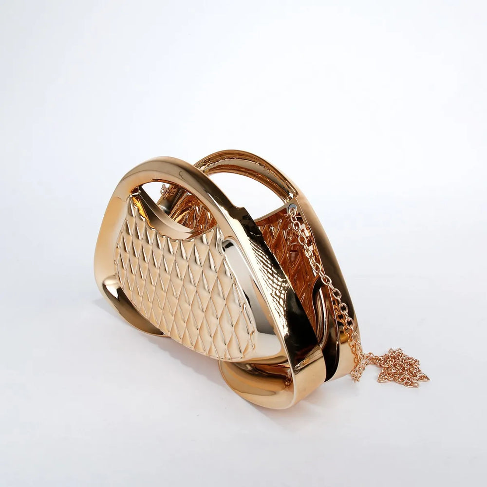 Gold handbag with chain detail on a white background