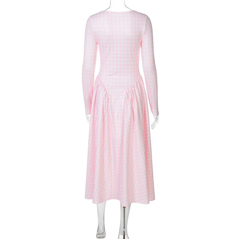 Pink dress on a mannequin against a white background