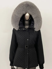 Black quilted jacket with a large fur hood on a mannequin against a white background