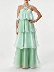 Halter neck tiered maxi dress with hand on hip