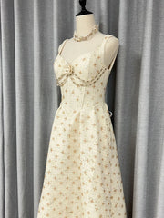Empire waist maxi dress with wide straps and flowing skirt silhouette