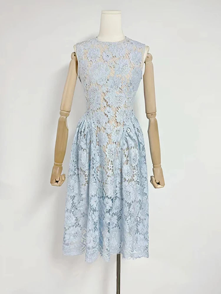 Light blue floral lace dress on a mannequin against a white background