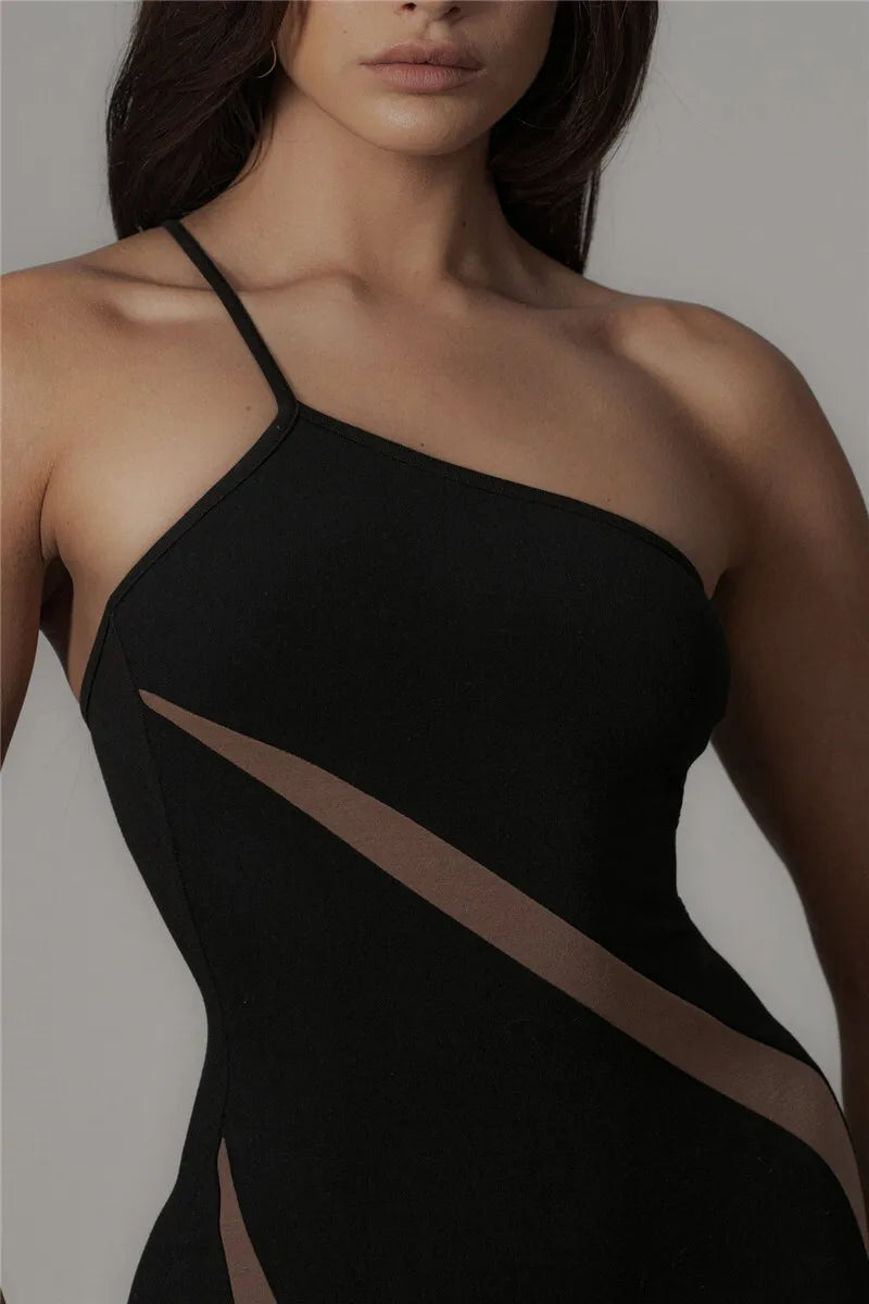 Black one-shoulder dress with cut-out design on a neutral background