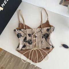 Back view of floral print corset top with lace-up closure
