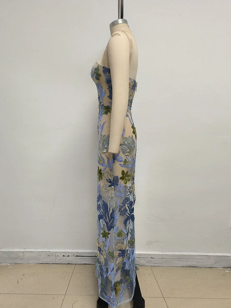 Floral dress on a mannequin against a plain background