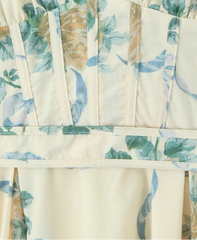 Close-up of a fabric with pineapple and leaf pattern on a beige background