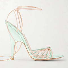 Strappy pointed toe thin heel ankle wrap sandal in mint green and pale pink.