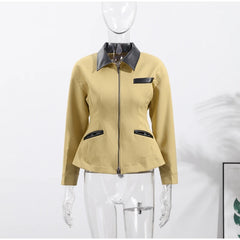 Beige jacket with black accents on a mannequin against a white background