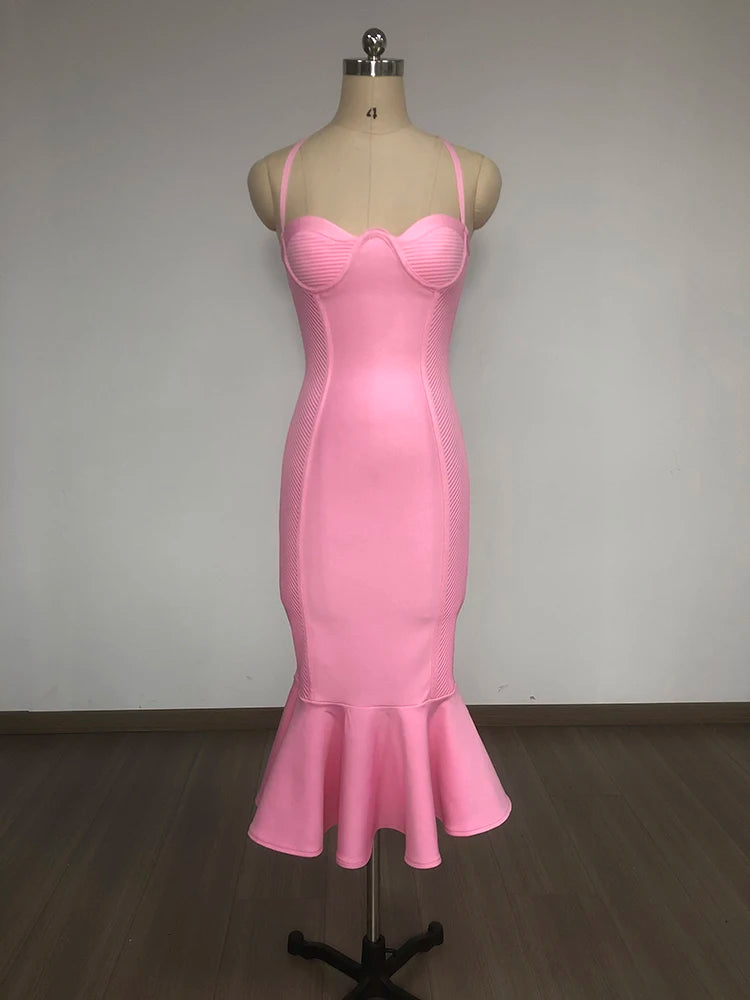 Pink dress on a mannequin against a plain background