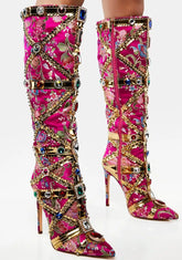 Decorative pink knee-high boots with gold and multicolor embellishments