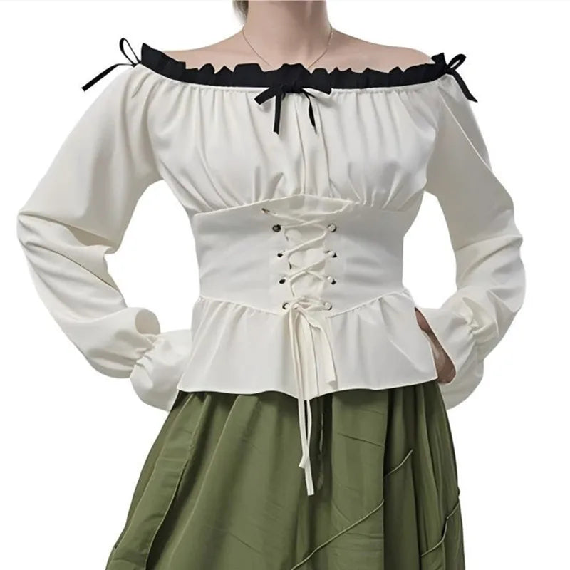 White off-shoulder top with black accents and green skirt on a white background