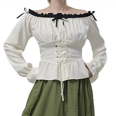 White off-shoulder top with black accents and green skirt on a white background