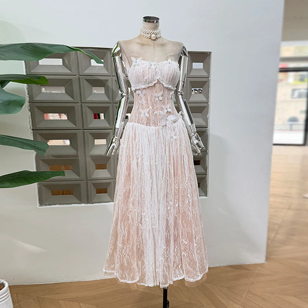 Lace dress on a mannequin against a neutral background