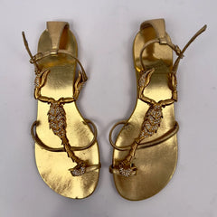 Pair of gold flat sandals with scorpion embellishment
