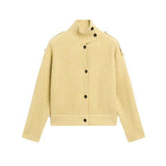 Yellow ribbed sweater with black buttons on a white background
