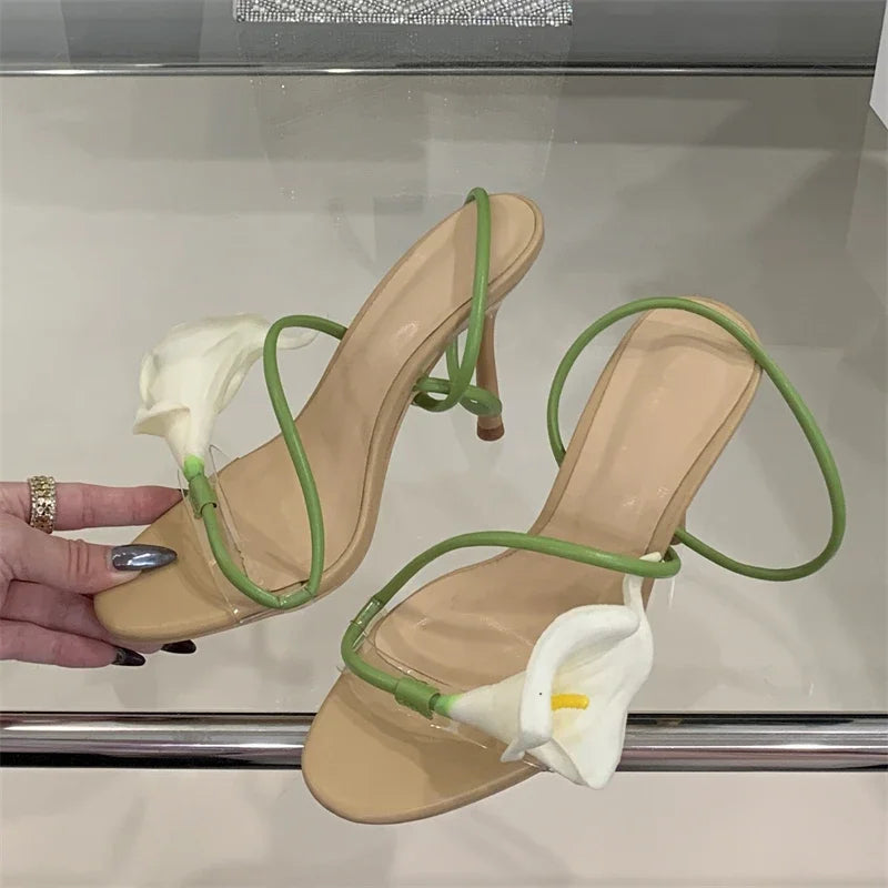 Close-up of transparent flower stiletto heels with floral detail