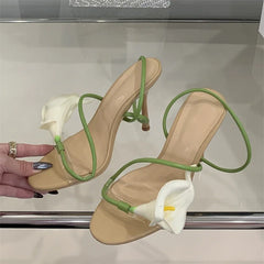Close-up of transparent flower stiletto heels with floral detail