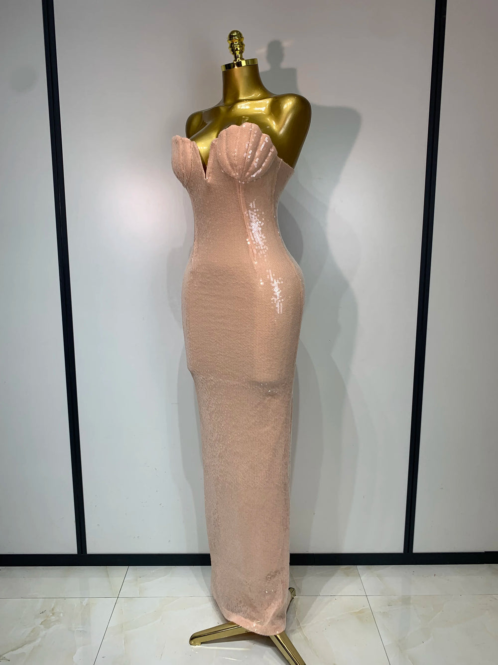 Strapless V-neck sequin column maxi dress on a mannequin from side