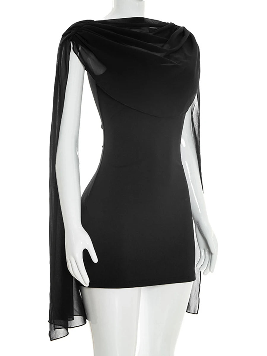 Mannequin displaying a black mini dress with draped cowl neckline and capelet sleeves, front view.
