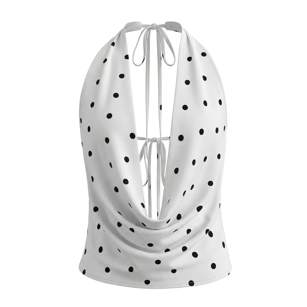 White halter top with black polka dots on a white background