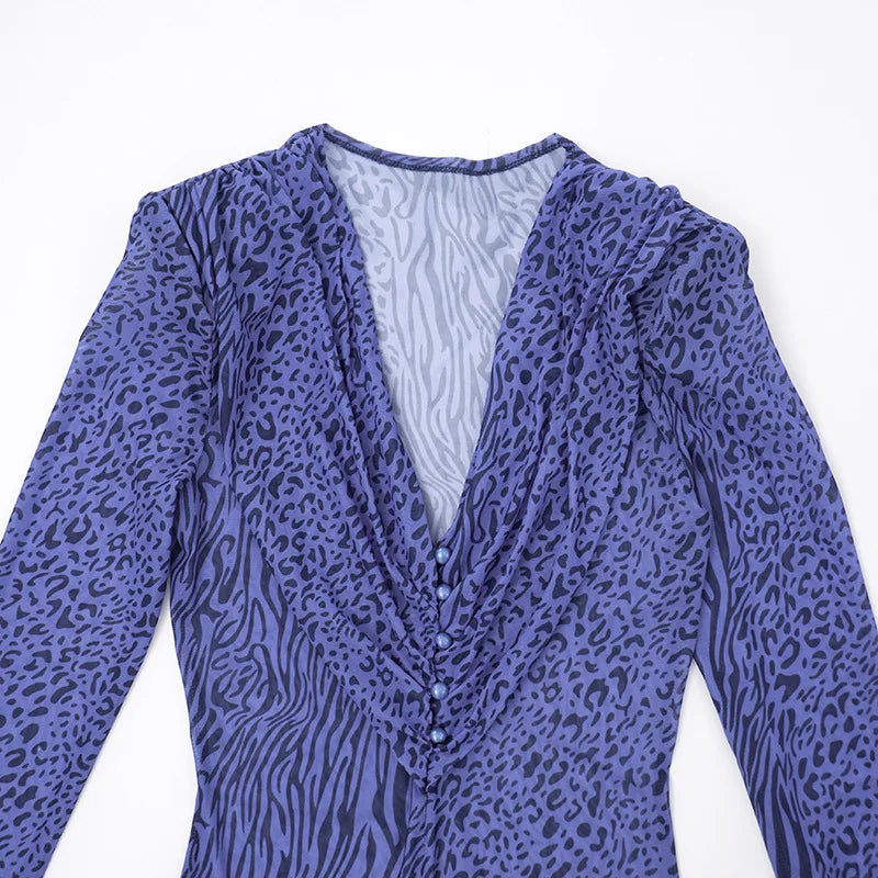Purple animal print long-sleeve top on a white background