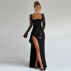 Woman wearing a black evening gown with lace sleeves on a plain background