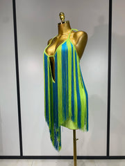 Side view of lime green and blue alternating fringe halter mini dress