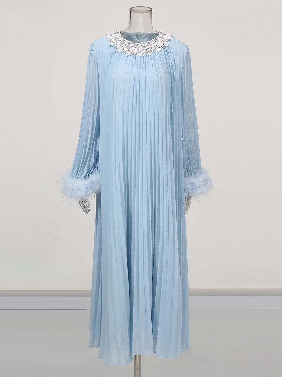 Light blue pleated dress with decorative collar on a mannequin against a white background