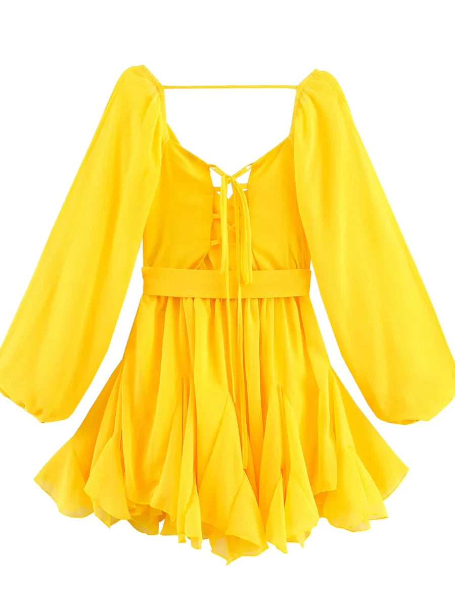 Yellow dress with long sleeves on a white background