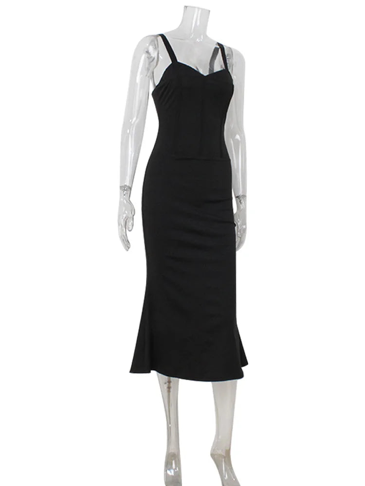 Black dress on a mannequin against a white background