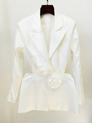 White blazer with floral details on a hanger against a white background