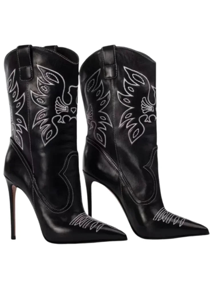 Close-up of black embroidered pointed stiletto cowboy boots