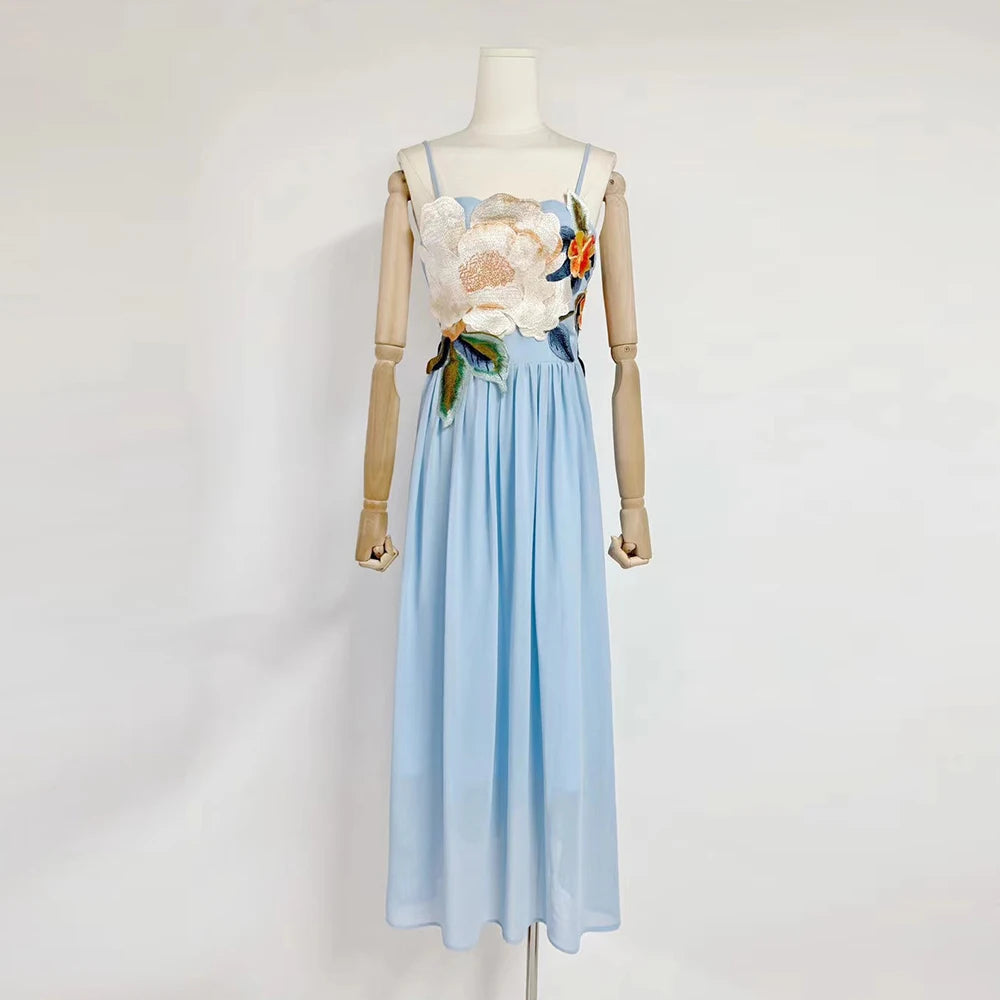 Mannequin wearing a floral top and light blue skirt on a white background