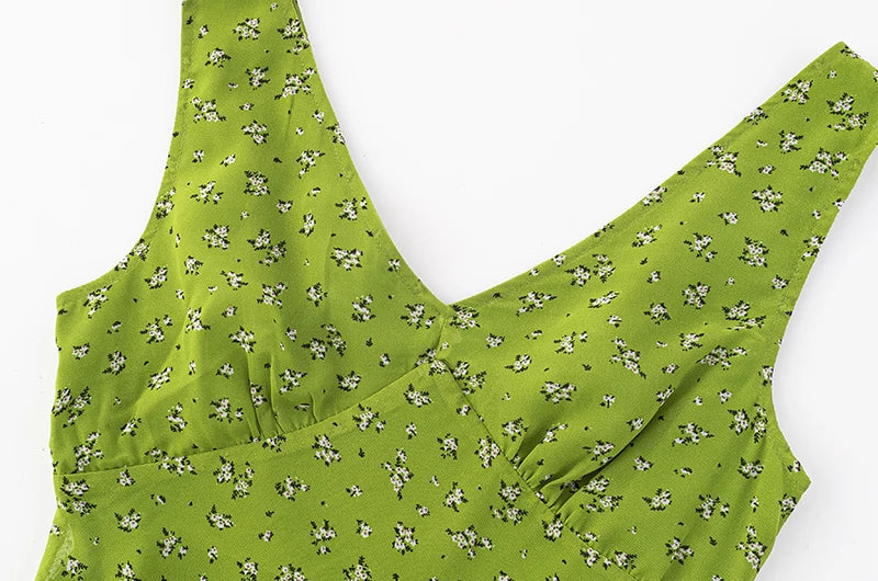 Close-up of the floral print on the green midi dress neckline