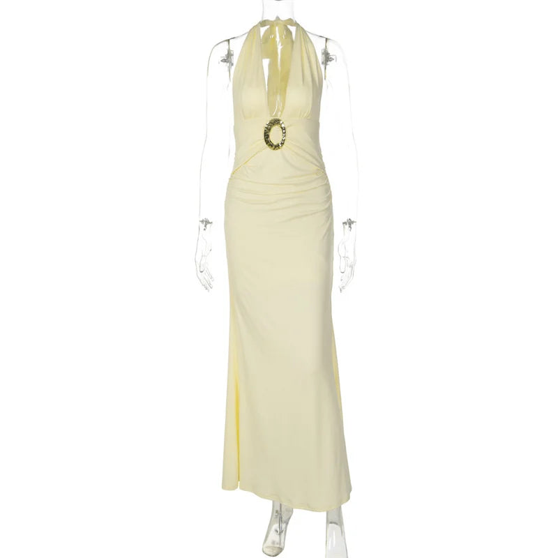 Yellow evening gown on a mannequin against a white background