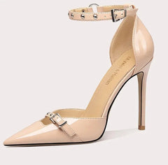 Beige high-heeled shoe with a strap on a white background