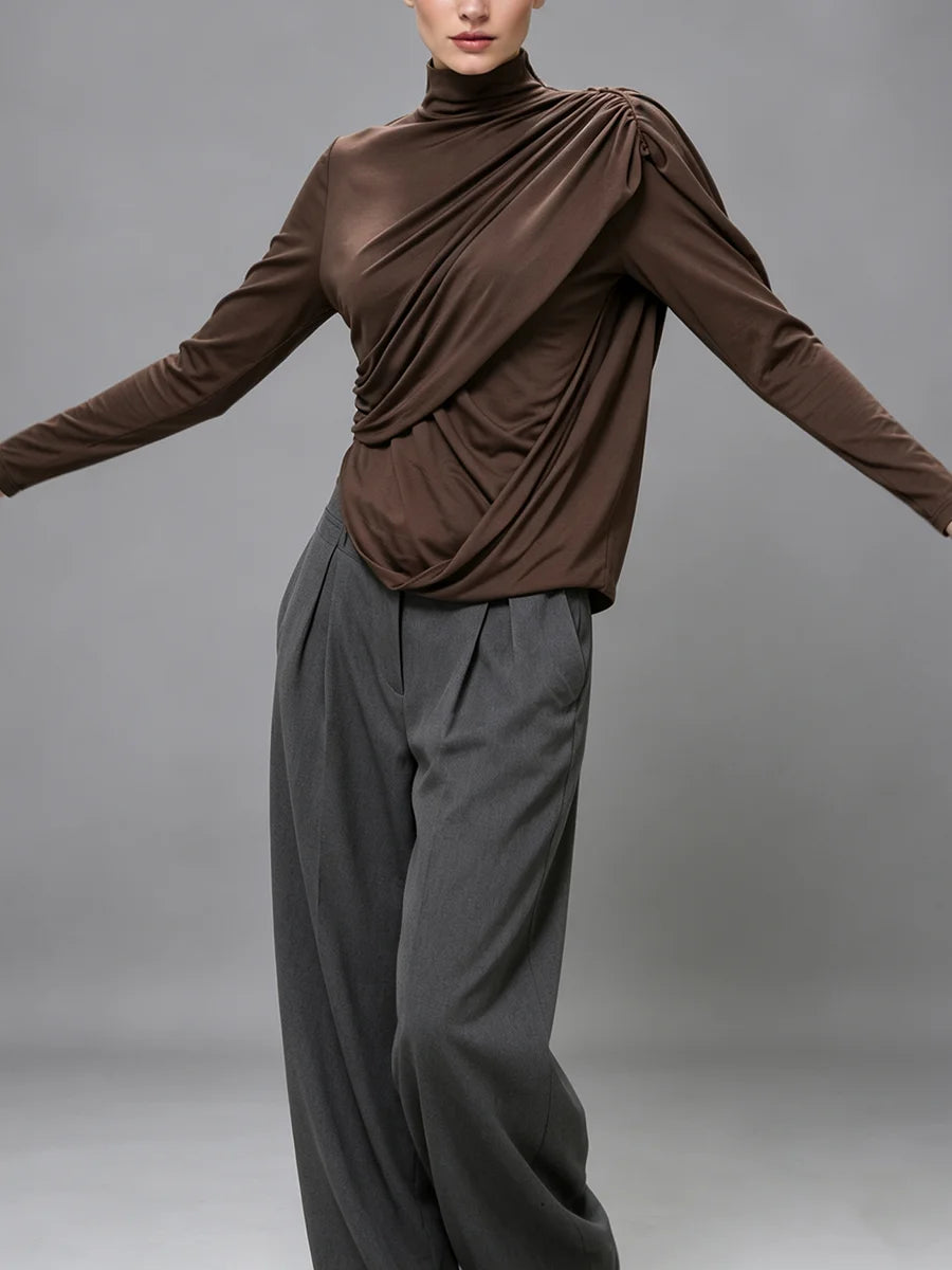Model wearing ruched turtleneck top