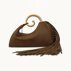 Brown handbag with gold handle and fringes on a white background