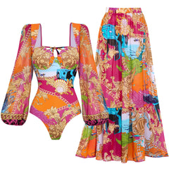 Flat lay of a printed long sleeve swimsuit top and a matching maxi skirt.