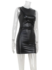 Black leather dress on a mannequin against a white background
