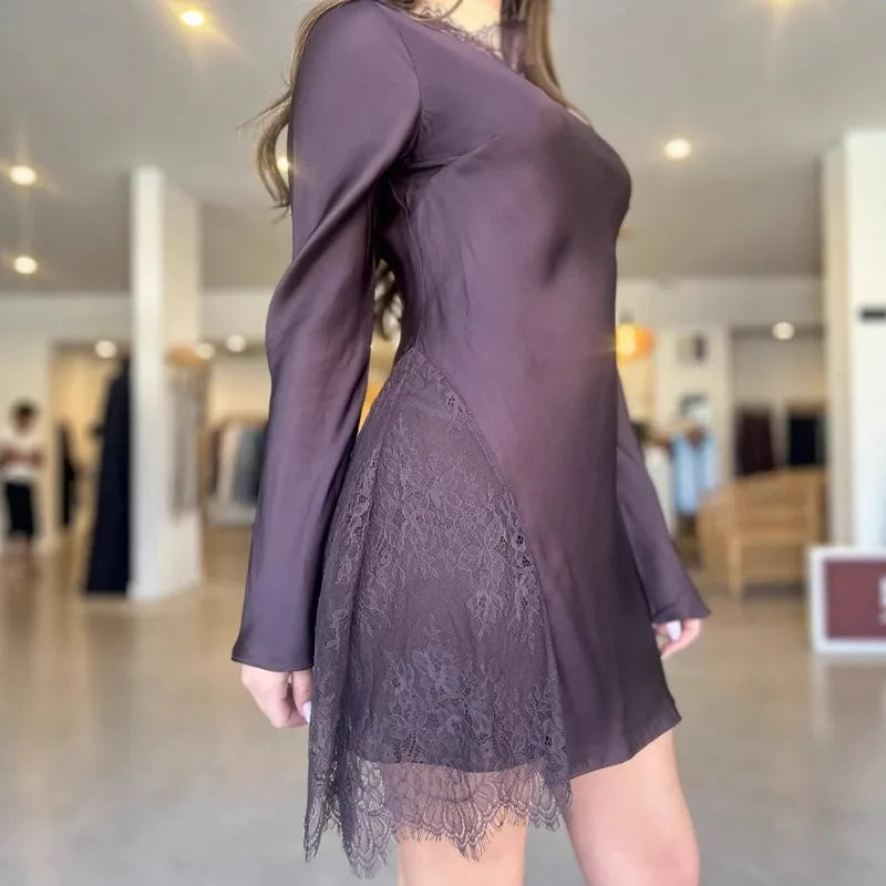 Purple dress with lace detailing in a store setting