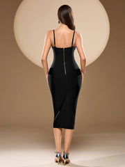 Woman wearing a black dress with a high slit on a beige background