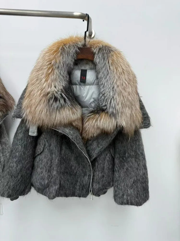 Gray coat with fur hood on a hanger against a white background