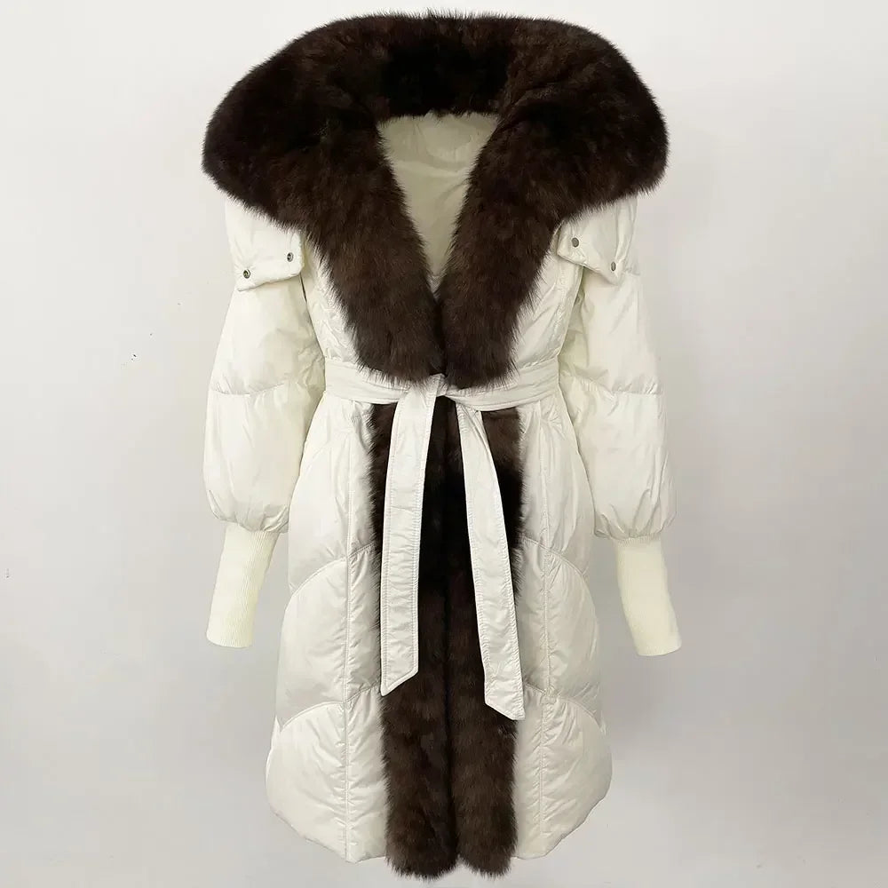 White winter coat with a fur collar and belt on a white background