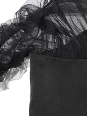 Black tulle fabric with a plain black background