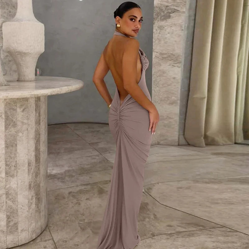 Woman in a elegant dress standing in a marble interior setting