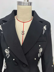 Black blazer with decorative elements on a mannequin against a white background
